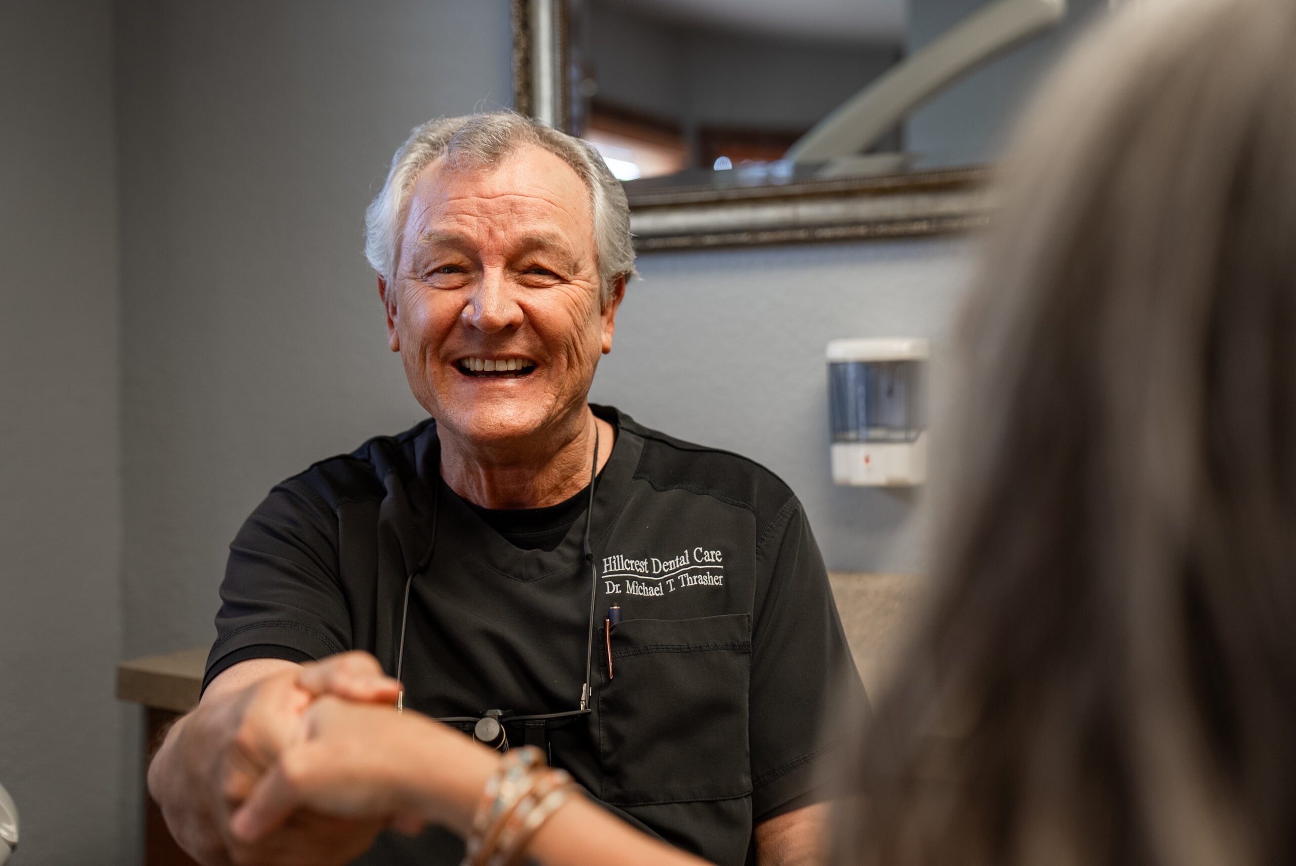 Dr. Thrasher shaking patient's hand